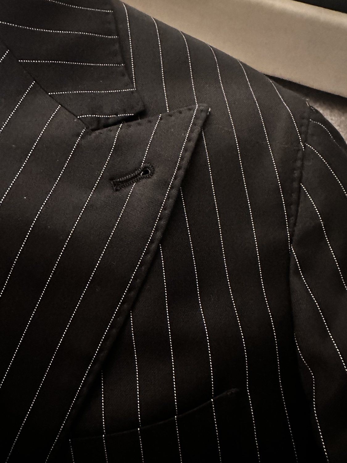 Black pinstripe custom suit lapel detail
